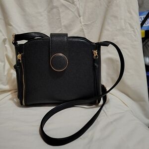 Chic Black Crossbody Bag with Gold Accents New Never Used. Very Cute